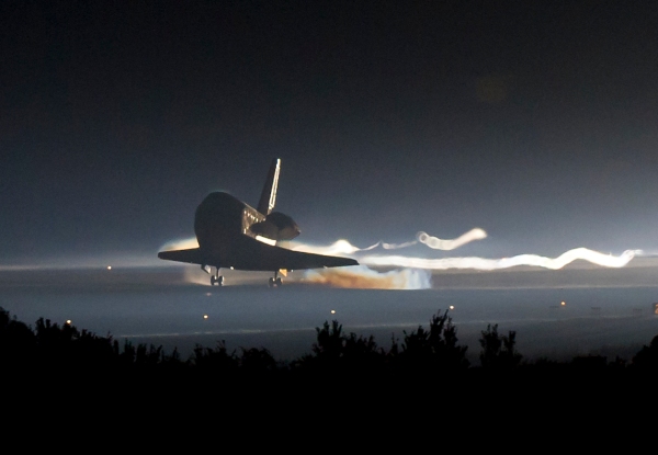 Space shuttle Atlantis (STS-135) touches down at NASA's Kennedy Space Center Shuttle Landing Facility (SLF), completing its 13-day mission to the International Space Station (ISS) and the final flight of the Space Shuttle Program, early Thursday morning, July 21, 2011, in Cape Canaveral, Fla. Overall, Atlantis spent 307 days in space and traveled nearly 126 million miles during its 33 flights. Atlantis, the fourth orbiter built, launched on its first mission on Oct. 3, 1985. Photo Credit: (NASA/Bill Ingalls)