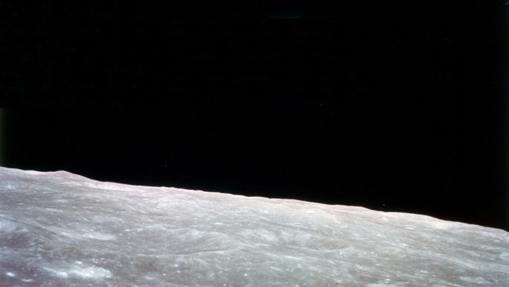 The lunar surface showing the black sky