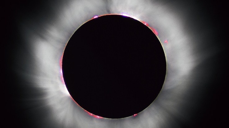 Total solar eclipse showing the glowing corona, the sun’s atmosphere, glowing around its disc.